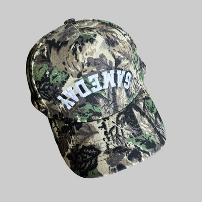 Camouflage-patterned baseball style hat with 'GAMEDAY' embroidered on a hat