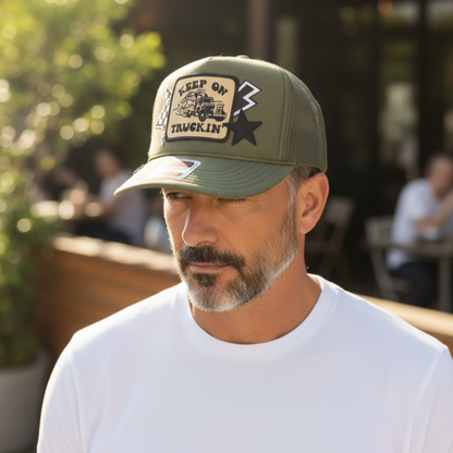 Man wearing a green patch hat on outside