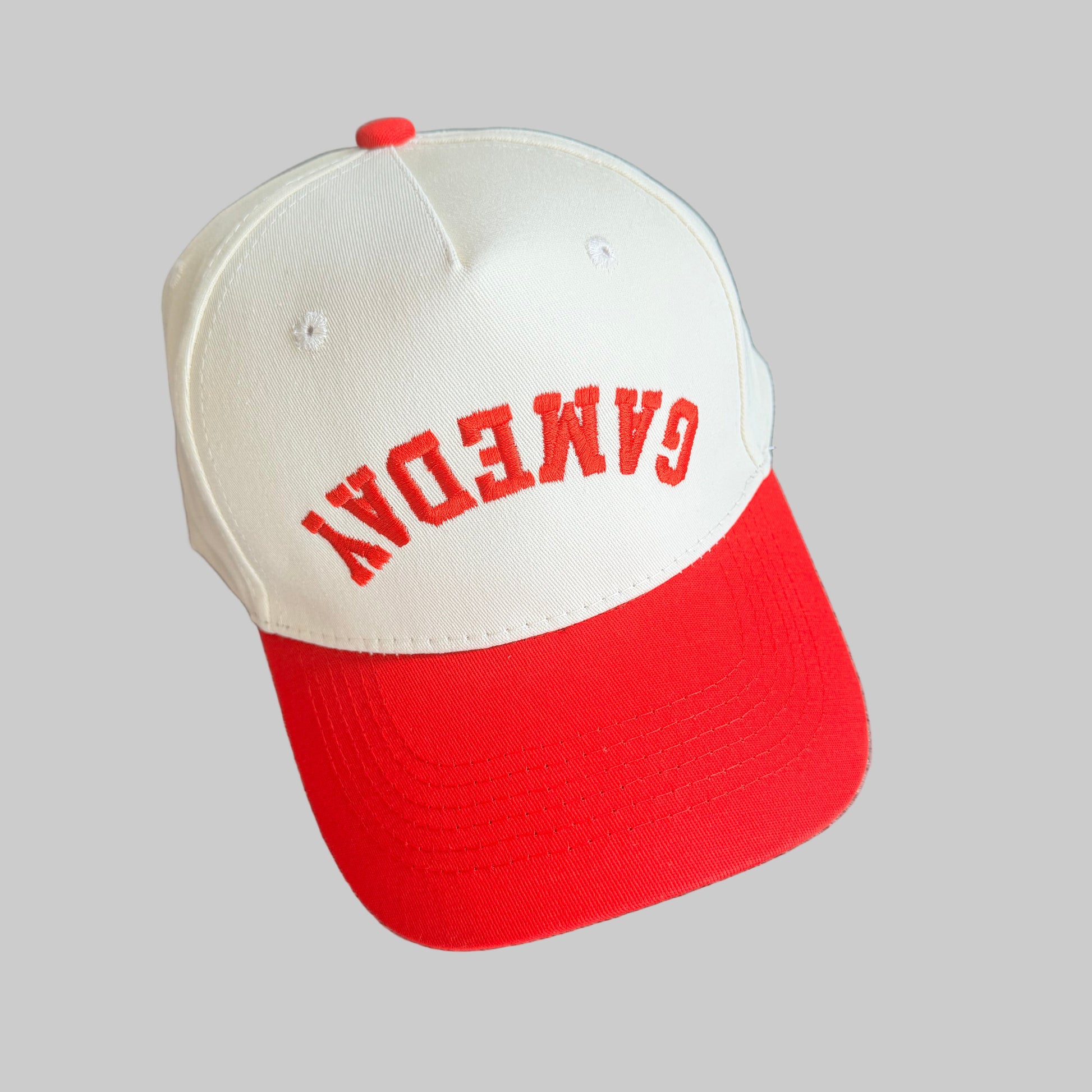 Red and cream cap with 'GAMEDAY' text on a baseball style  hat.  